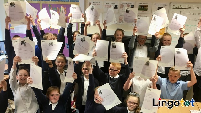 Primary school children celebrating their Lingotot language qualifications
